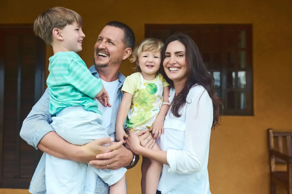 family hugging outside