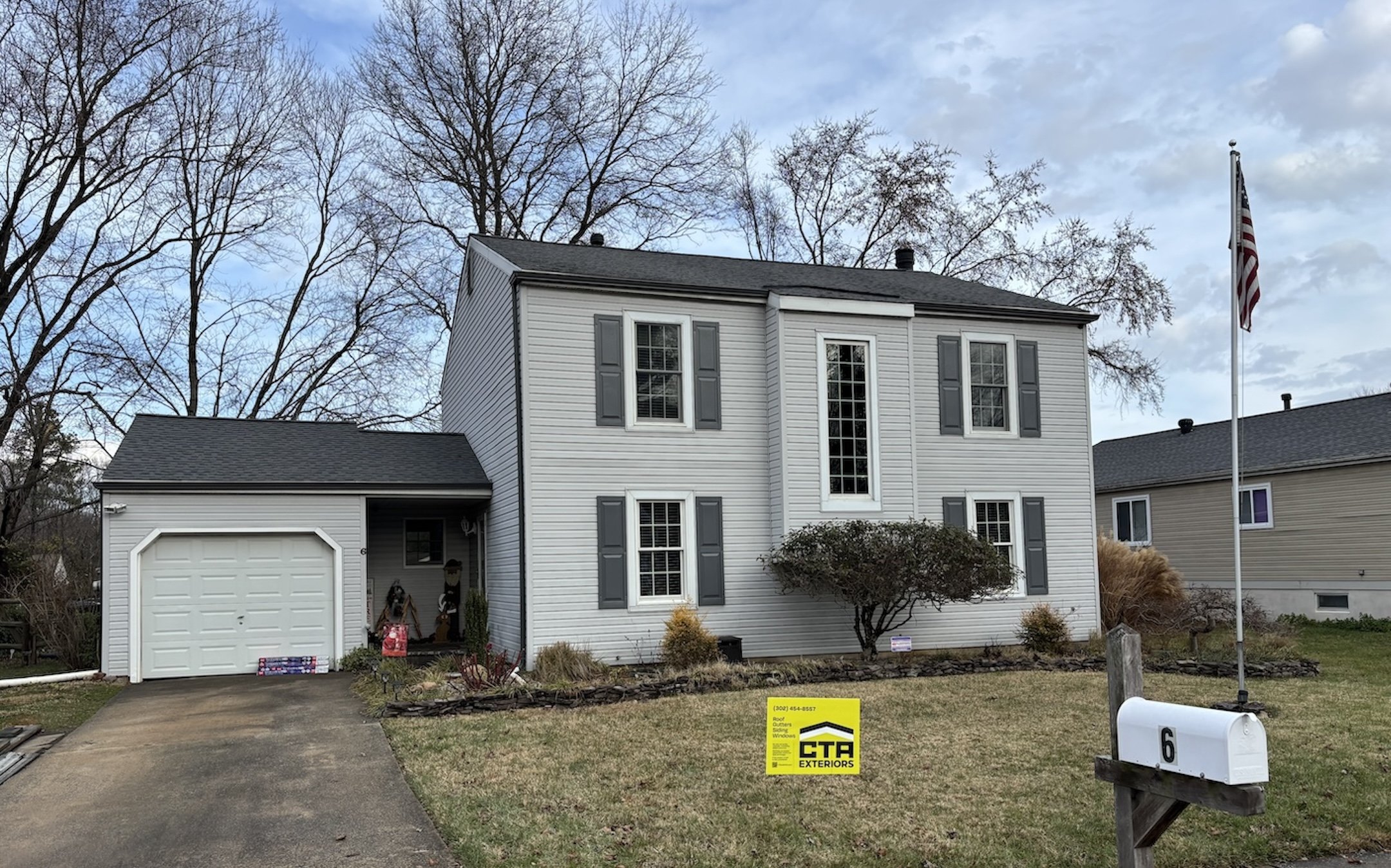 light gray siding new asphalt roof