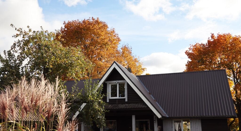 beautiful brown home with new metal seam roof