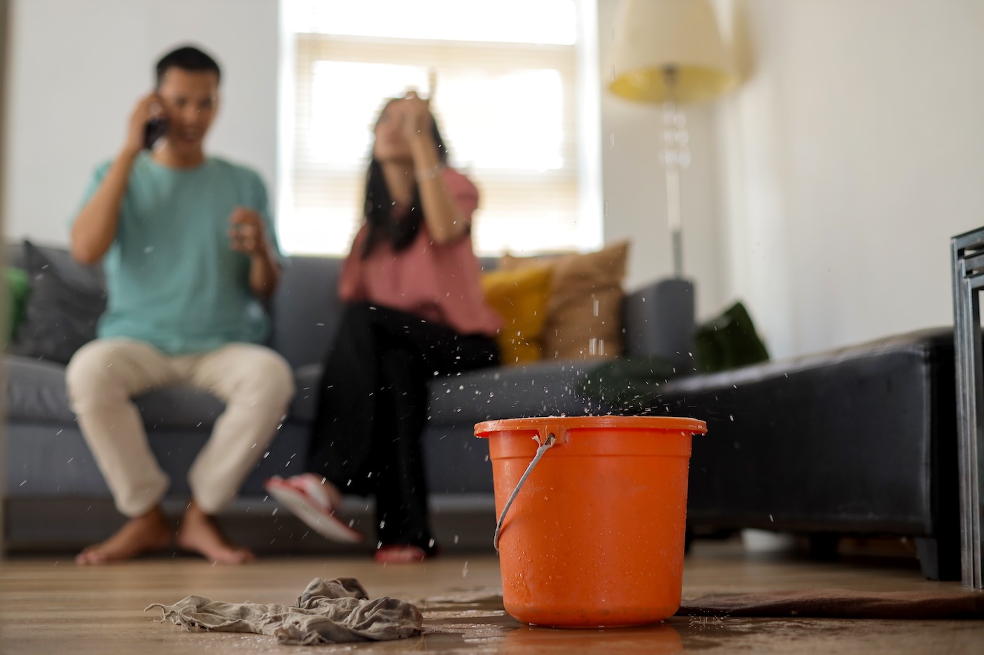 people in home experiencing a roof leak