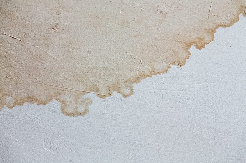 traces of stains on the painted white wall