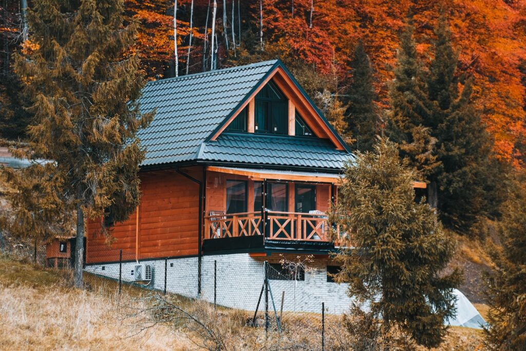 Barnhouse style houses. A street with cozy small houses. Living in the suburban. Concept of mortgage loan. Modern construction. Pros and cons of wooden house and suburban real estate concept.