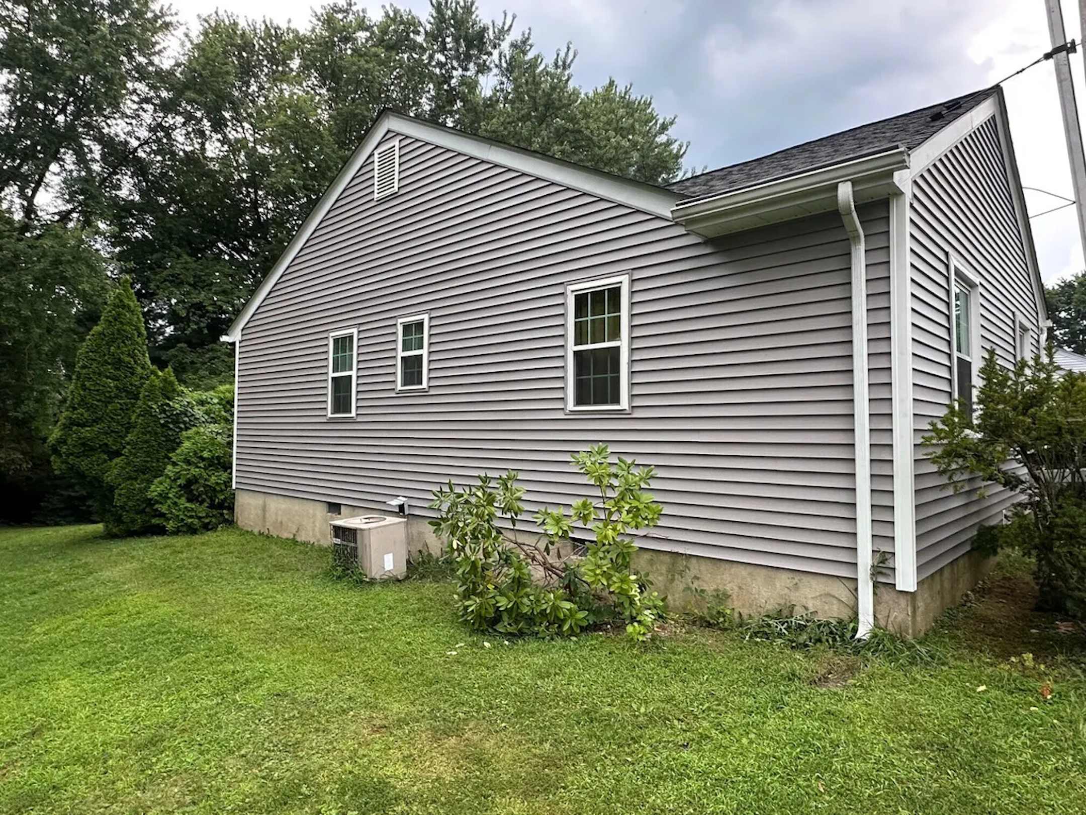 New Siding installed on grey house