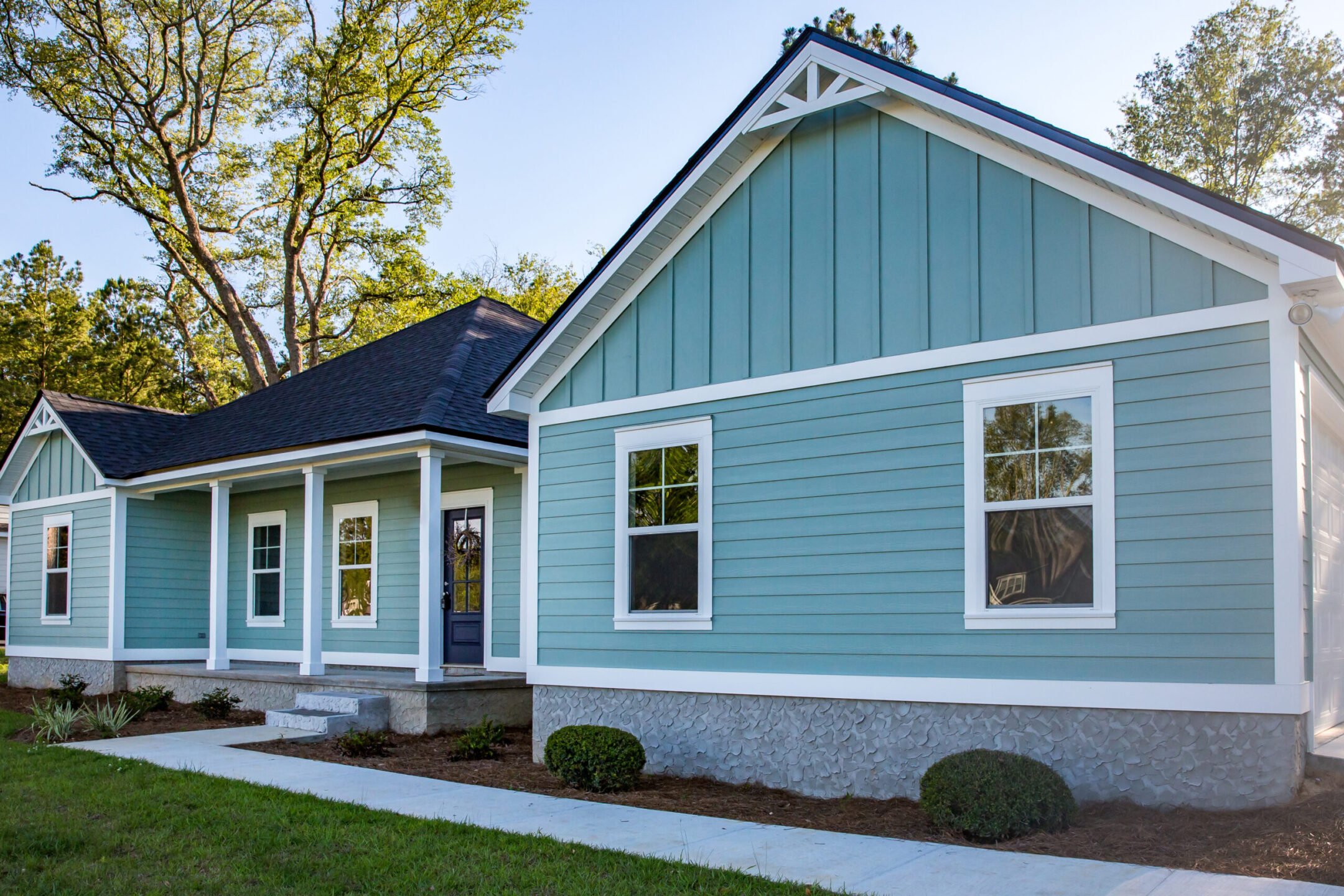brand new construction house with blue siding