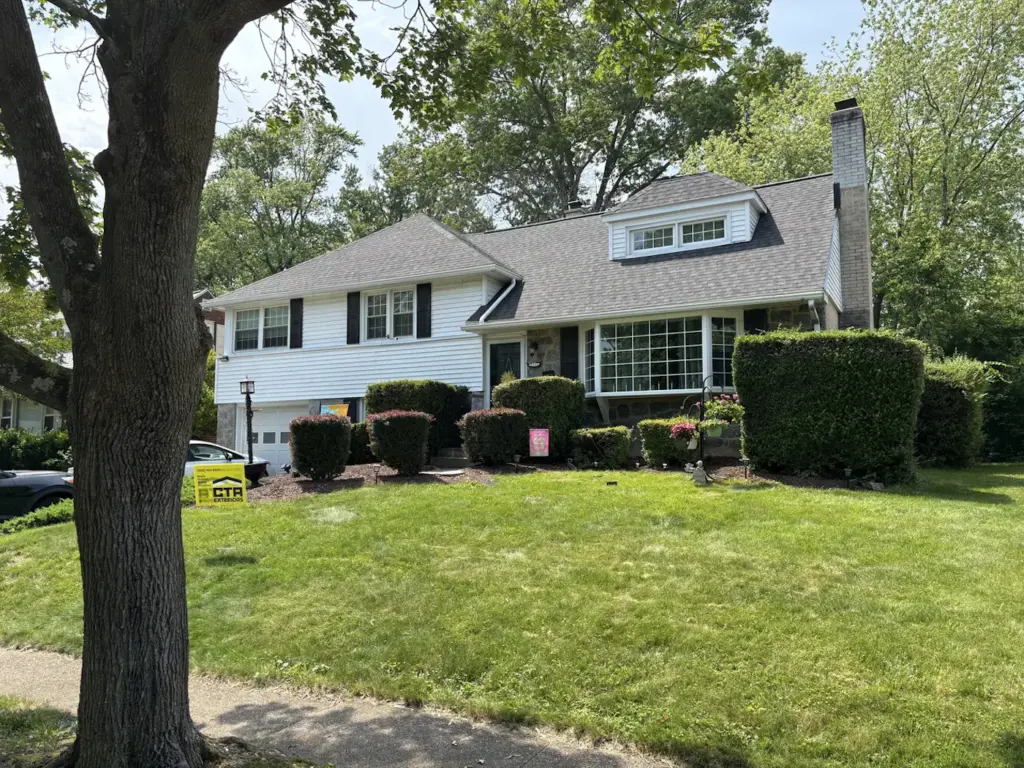 New Siding installed on grey house