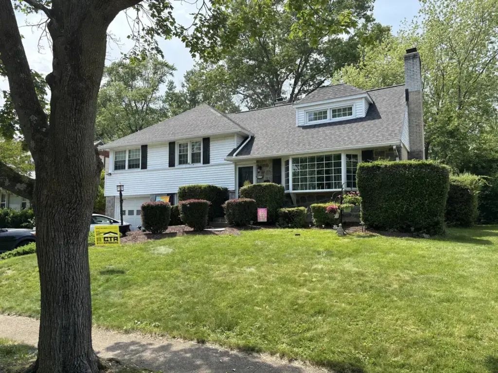 New Siding installed on grey house