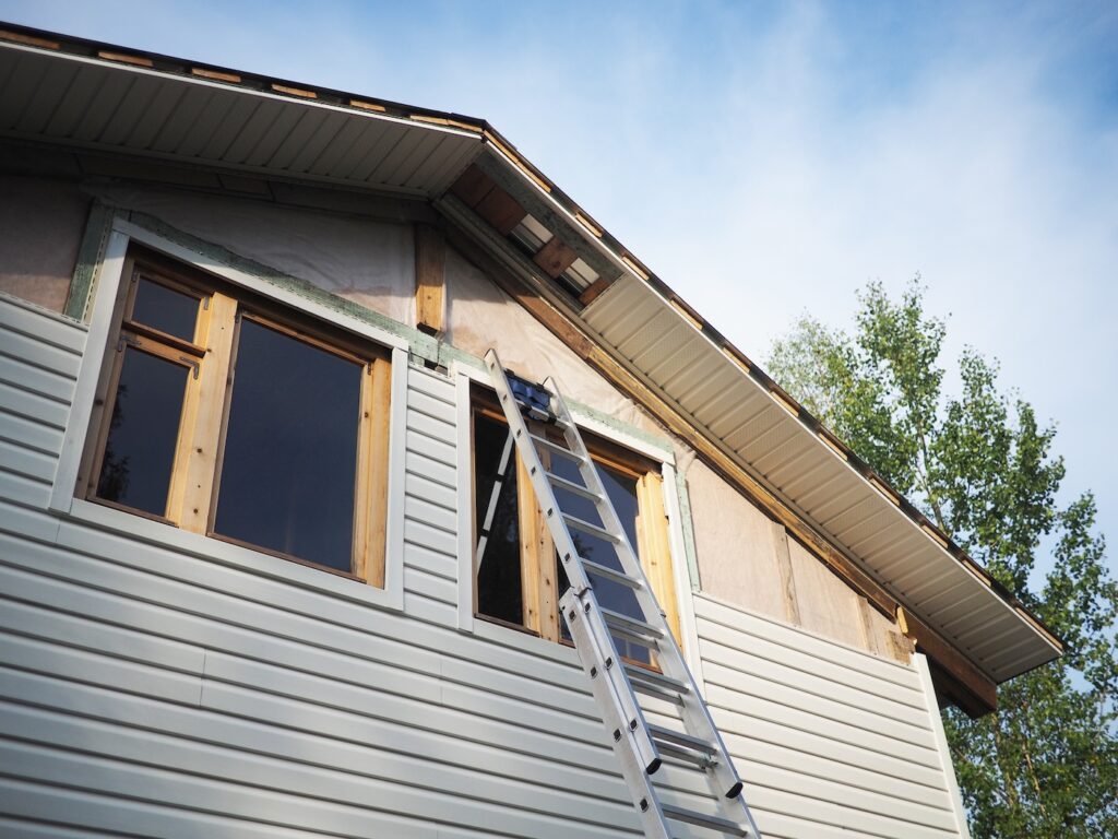 ladder in front of siding install