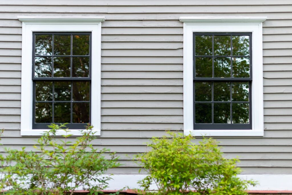 window installation pike creek de two windows grey siding
