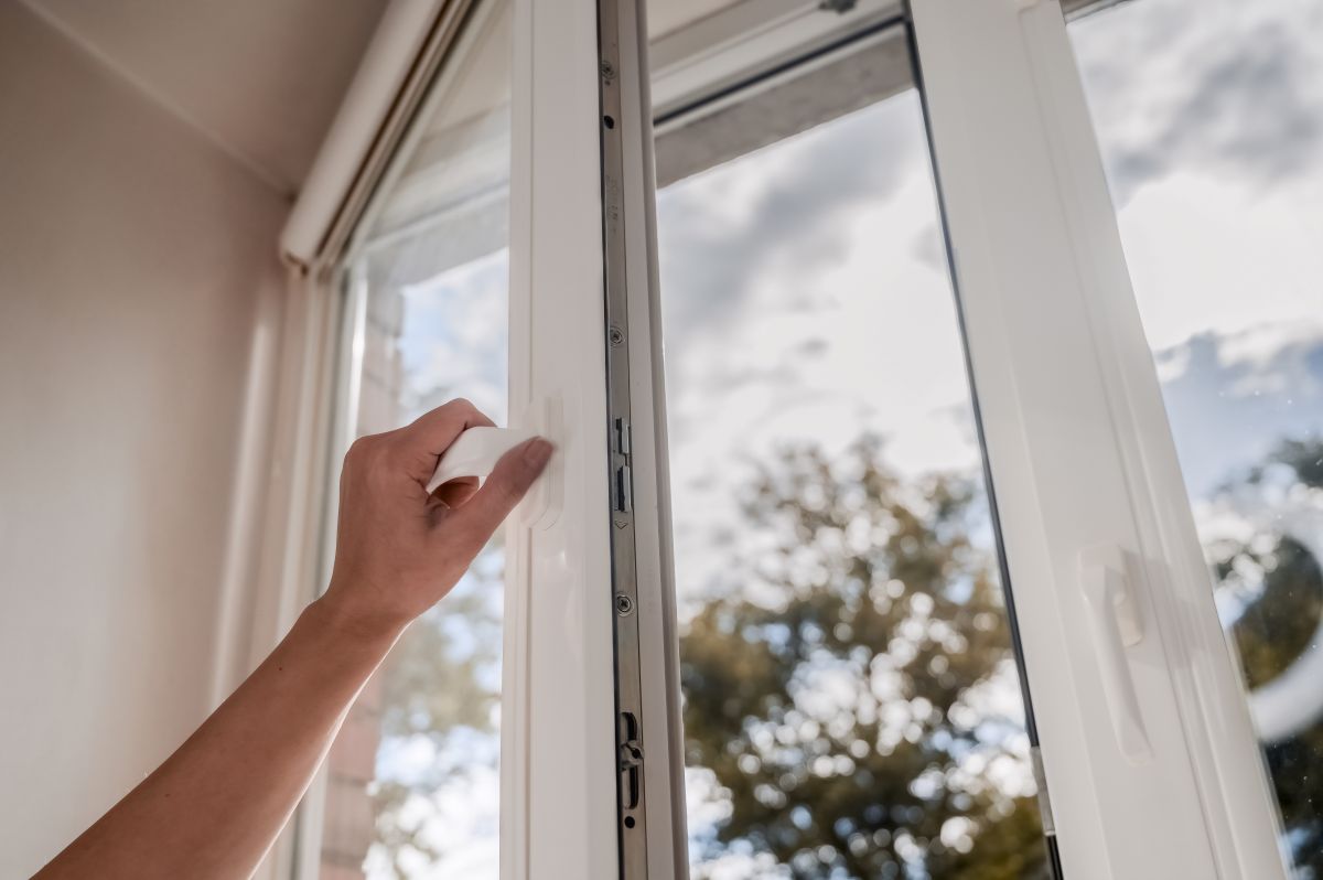 window installation dover de hand holding white window