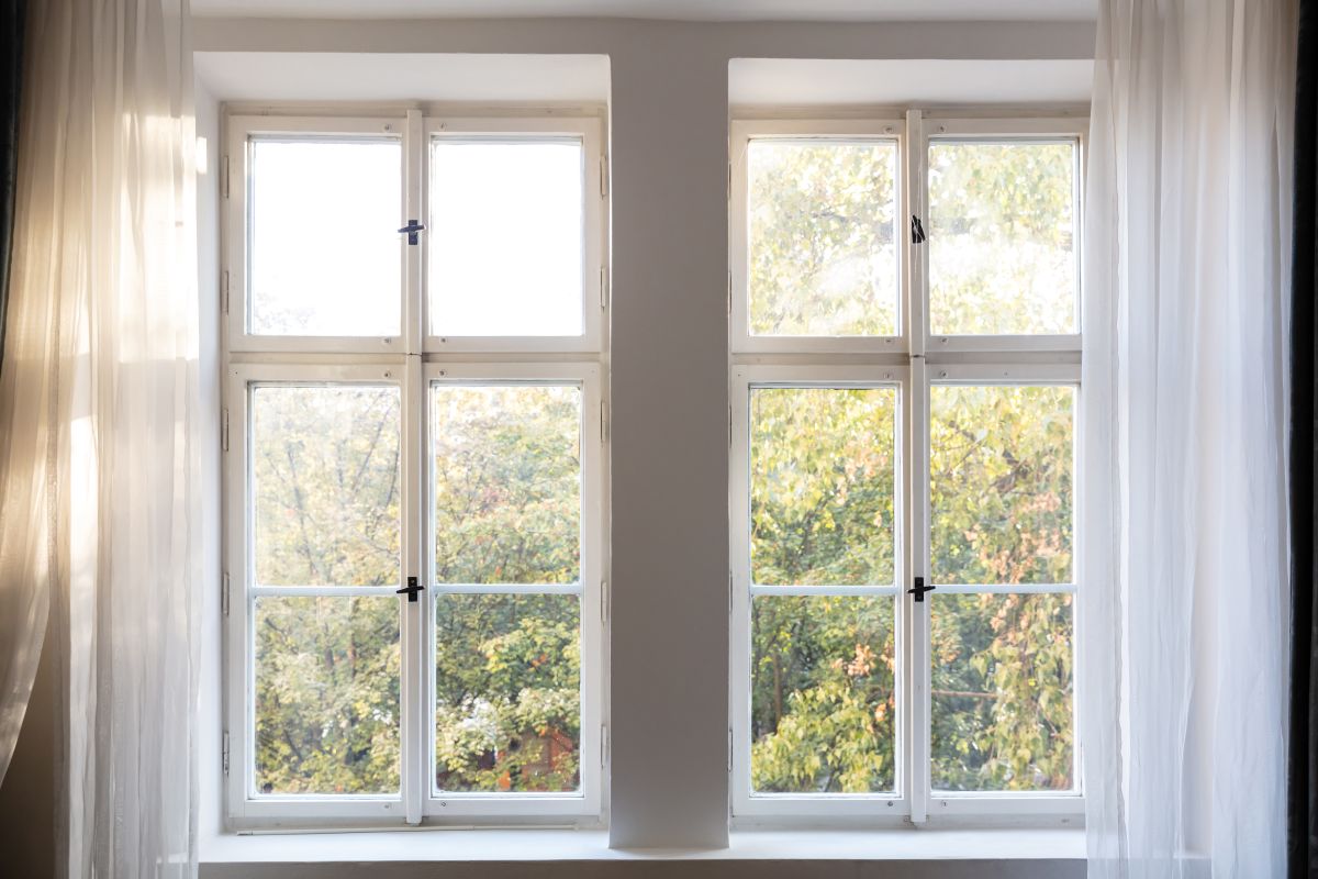 window installation wilmington de close up white window and curtain