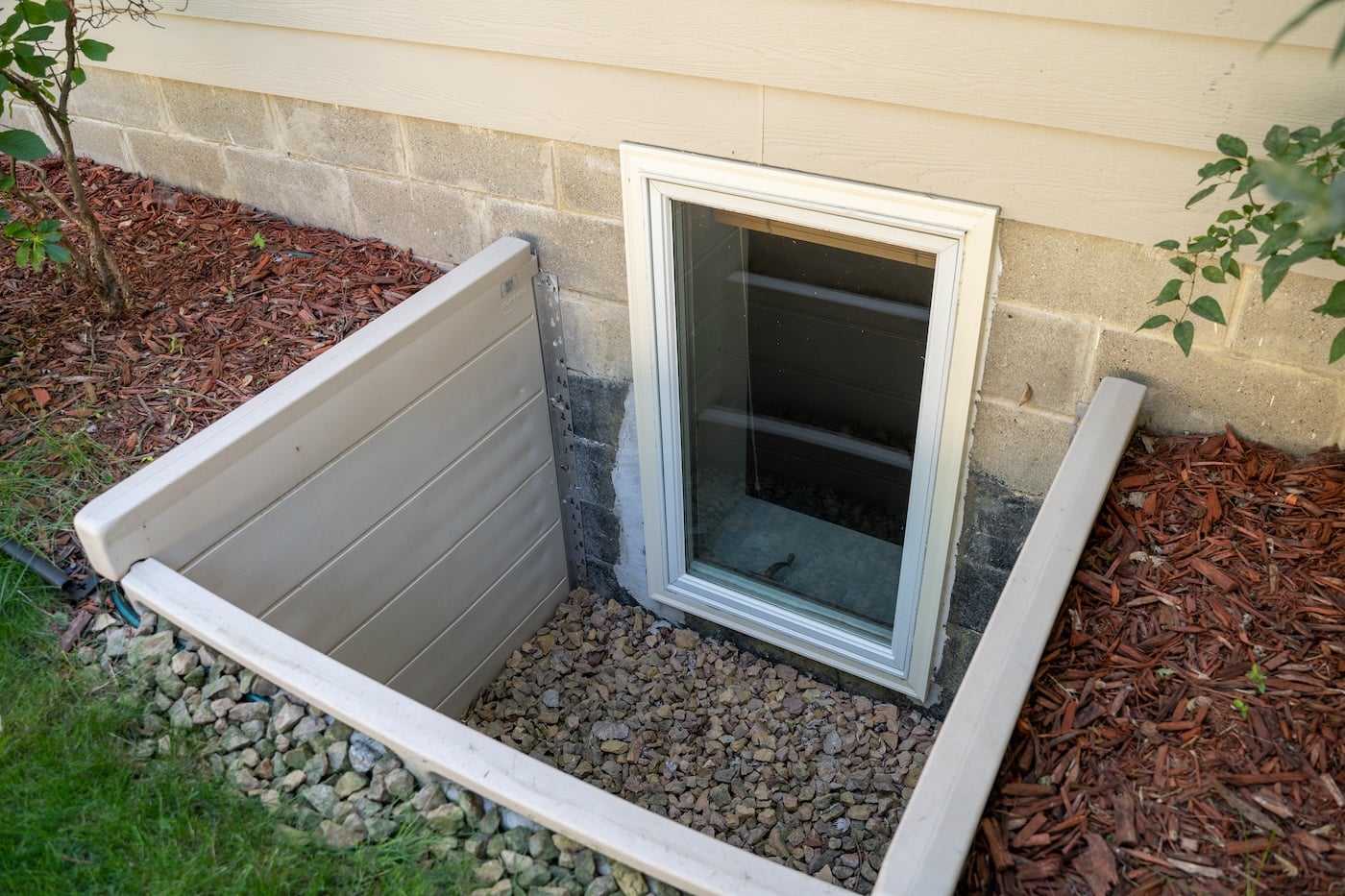 Exterior view of an egress window in a crawl space