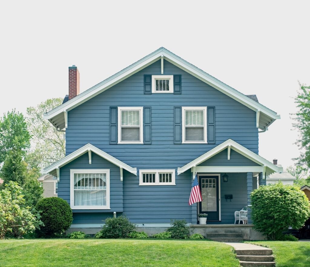 Basic Blue House with Small Porch and seamless siding installation