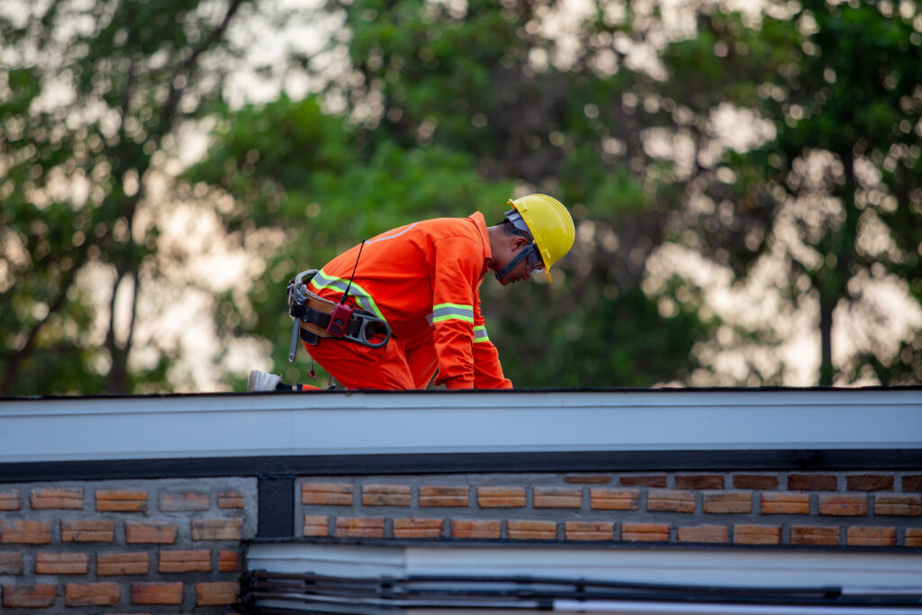 commercial roofing wilmington de Mechanic in uniform, safety at work, roof, building