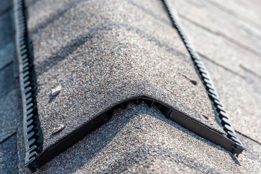 lincoln university roofing contractors typical Ridge cap vent installed on a shingle roof for passive attic ventilation