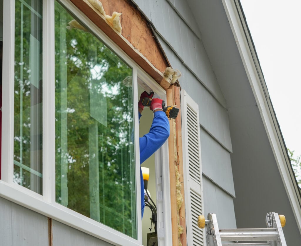 guy installing a new window 