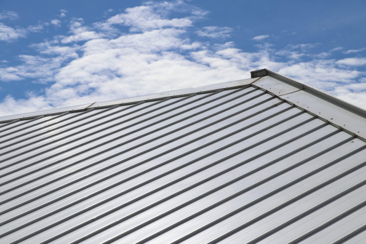 metallic roof under blue sky Galvalume vs galvanized metal roofing