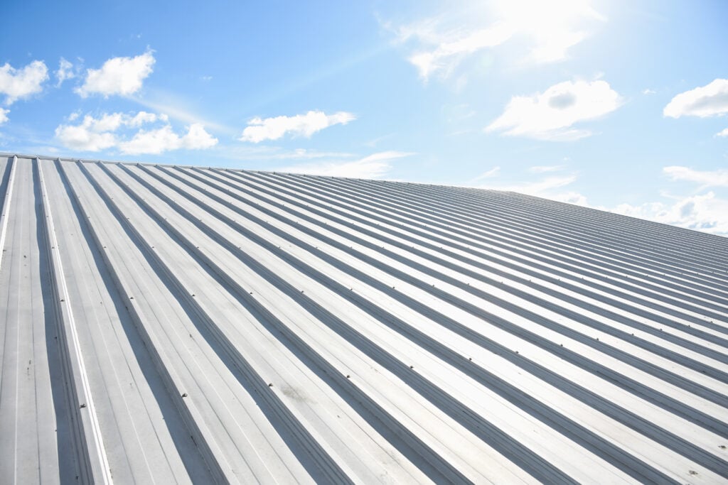Galvalume vs galvanized metal roofing metal sheet roofing on commercial construction with blue sky