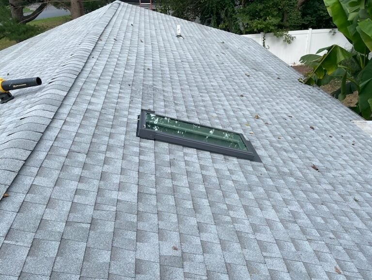 grey shingles roof after repairs